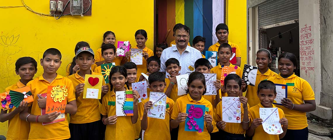 Sarthak Foundation — Yellow Rooms children with artwork